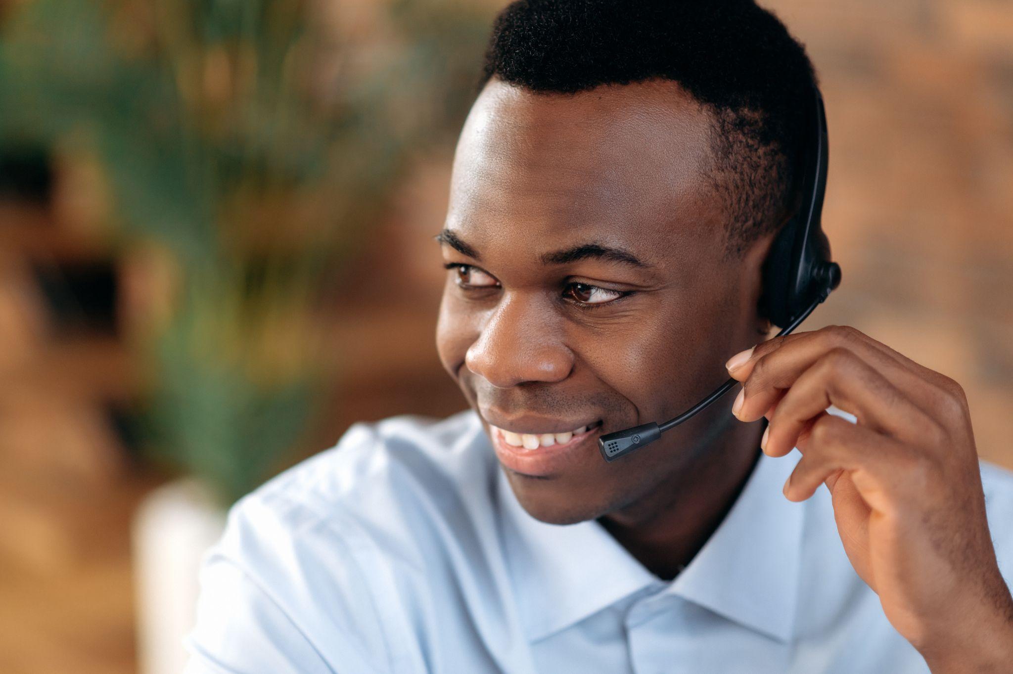 African american call operator in headset. Call center business or customer service concept