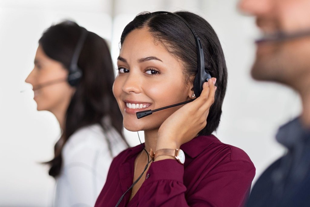 Young latin woman in customer service center